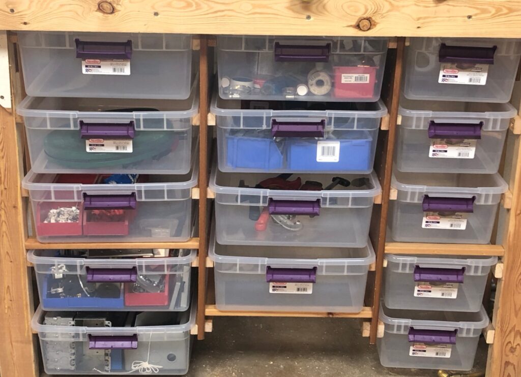 plastic bins used in shop as drawers to organize